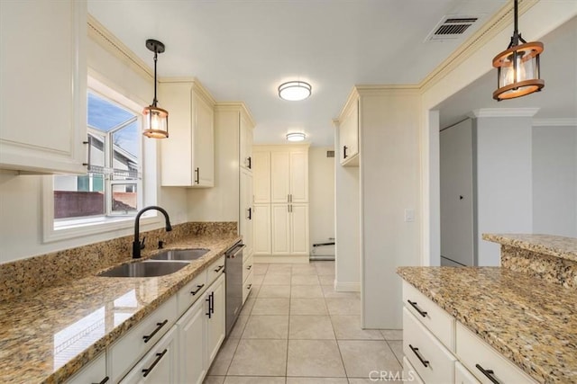 kitchen featuring pendant lighting, sink, baseboard heating, light stone counters, and stainless steel dishwasher