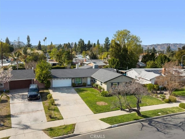 birds eye view of property featuring a mountain view