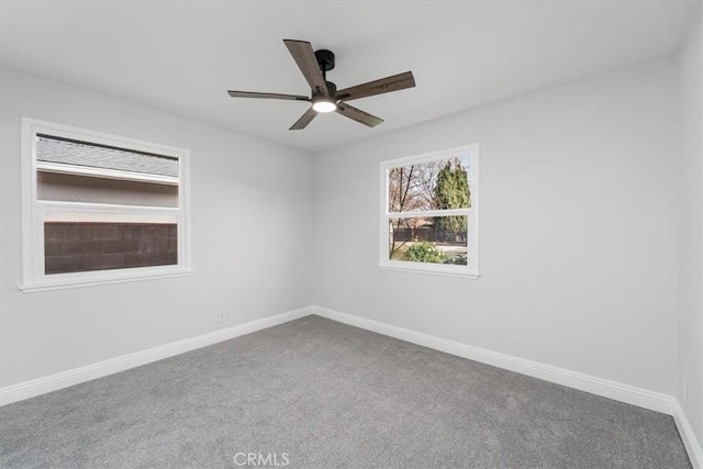 carpeted empty room featuring ceiling fan