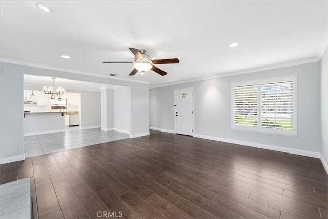 unfurnished living room featuring dark hardwood / wood-style flooring, ceiling fan with notable chandelier, and ornamental molding