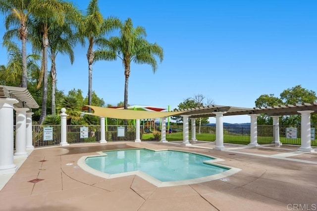 view of pool with a pergola and a patio area