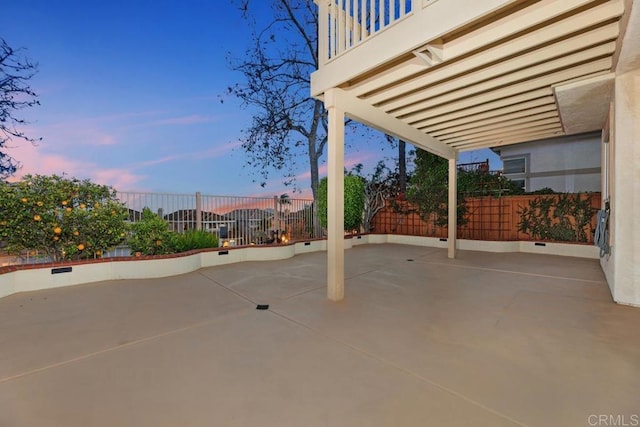 view of patio terrace at dusk