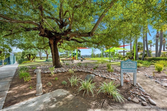 view of property's community with a playground