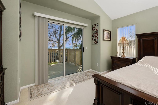 bedroom featuring vaulted ceiling, carpet, and access to outside