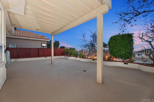 view of patio terrace at dusk