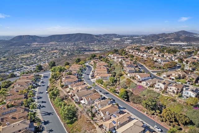 birds eye view of property featuring a mountain view