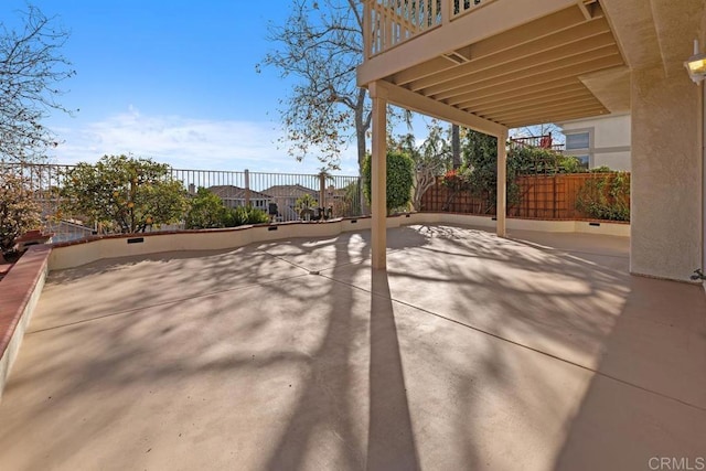 view of patio / terrace featuring fence