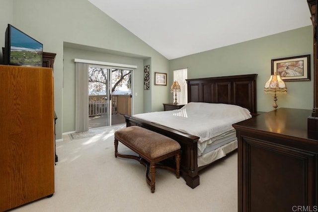 bedroom with lofted ceiling, light carpet, and access to exterior