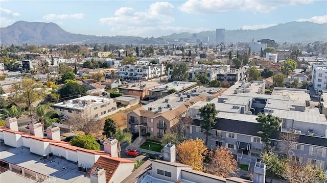 birds eye view of property with a mountain view