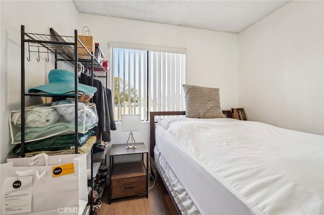 bedroom featuring hardwood / wood-style flooring