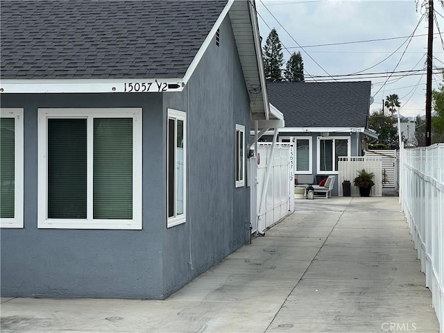 view of side of home with a patio