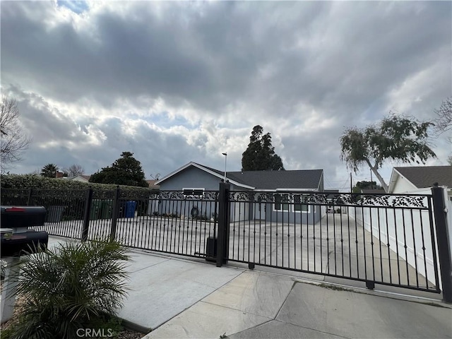 view of gate featuring a garage