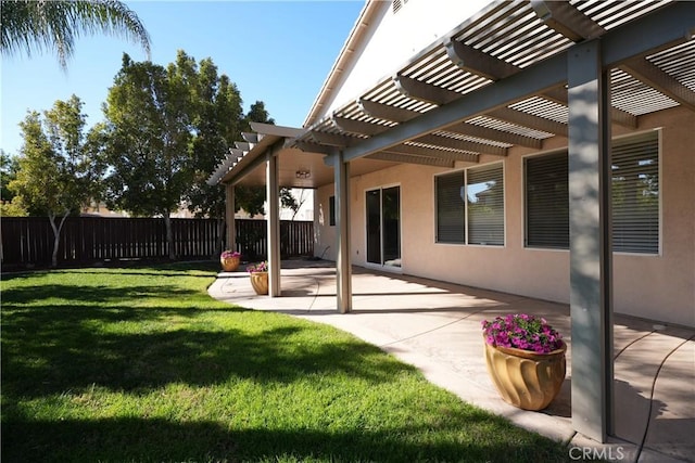 view of yard with a pergola and a patio area