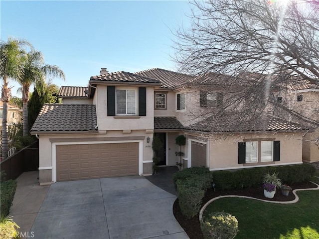 mediterranean / spanish-style home featuring a garage