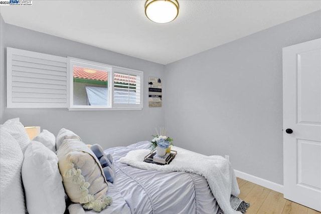 bedroom with light hardwood / wood-style flooring