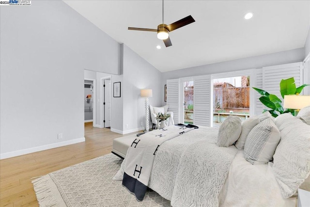 bedroom with ceiling fan, high vaulted ceiling, and light wood-type flooring