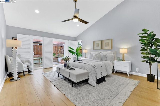 bedroom featuring ceiling fan, access to exterior, high vaulted ceiling, and light hardwood / wood-style flooring