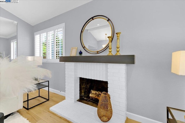 details featuring a brick fireplace and wood-type flooring