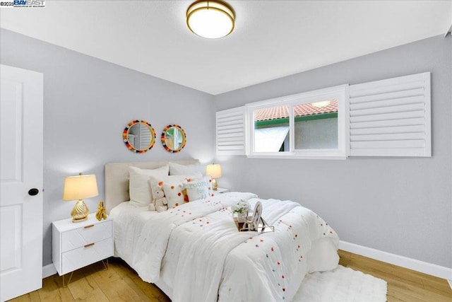 bedroom featuring hardwood / wood-style flooring