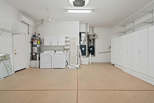 garage featuring gas water heater, heating unit, washer and clothes dryer, a garage door opener, and a wall unit AC