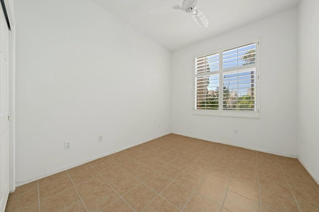 unfurnished room featuring light tile patterned floors and ceiling fan