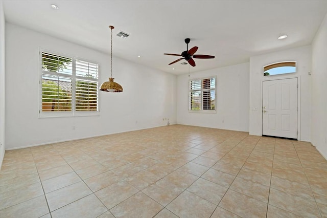 interior space with a wealth of natural light and ceiling fan