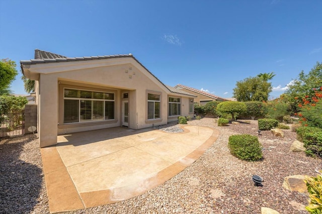 rear view of house with a patio