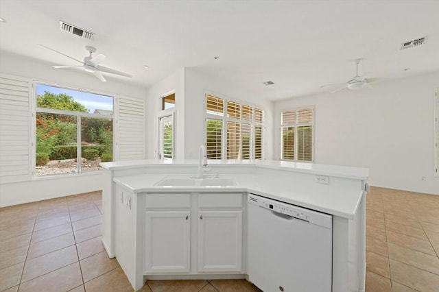 kitchen with white cabinetry, dishwasher, sink, a kitchen island with sink, and ceiling fan