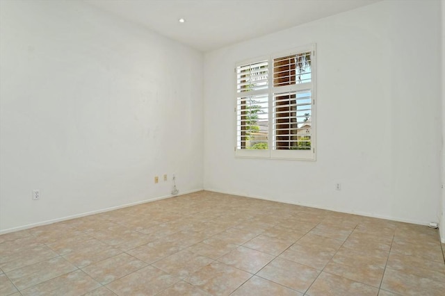 spare room with light tile patterned floors