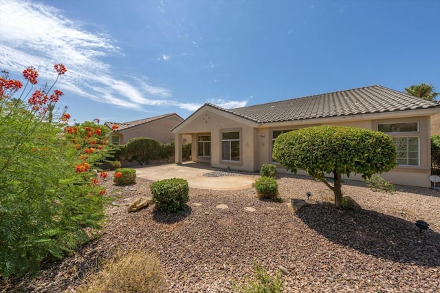 back of house with a patio area