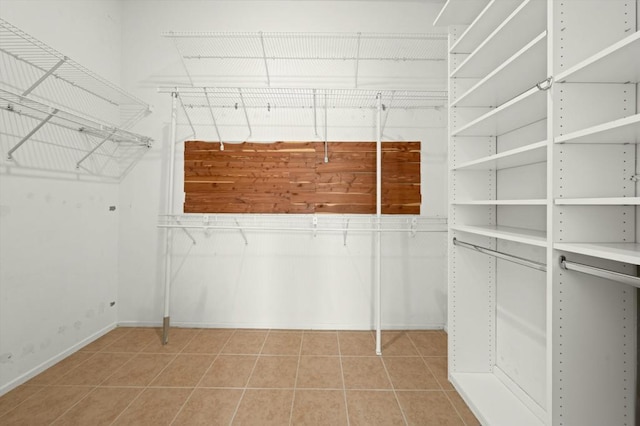 spacious closet featuring light tile patterned floors