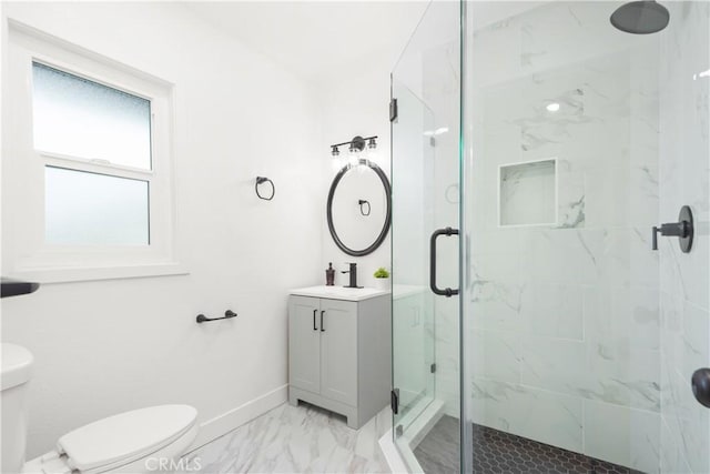 full bath with toilet, a stall shower, marble finish floor, and vanity