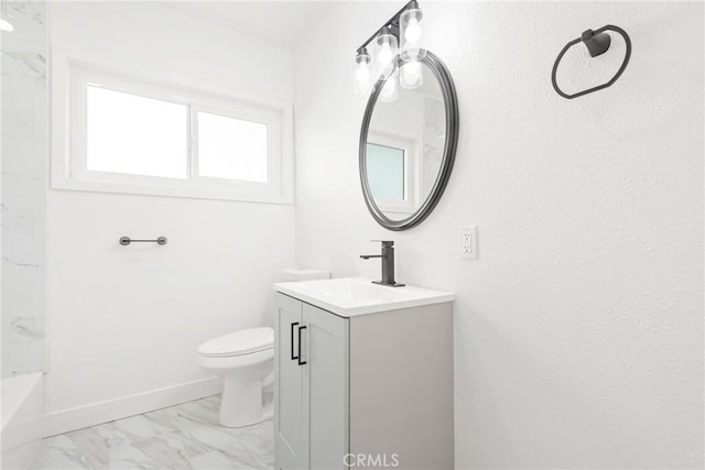 full bathroom with toilet, marble finish floor, vanity, and baseboards