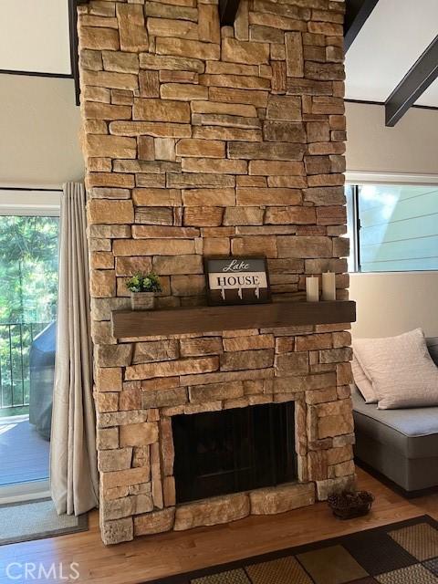 interior details with hardwood / wood-style floors and a fireplace