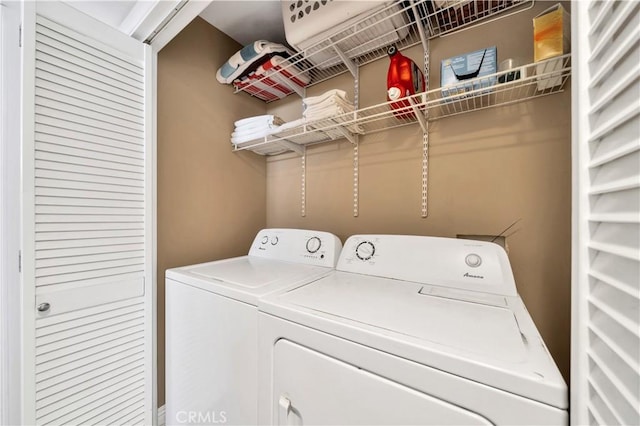 laundry room with washing machine and dryer