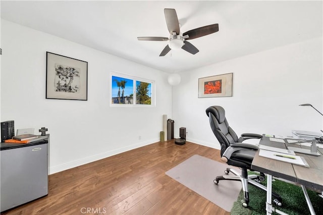 office space with hardwood / wood-style flooring and ceiling fan