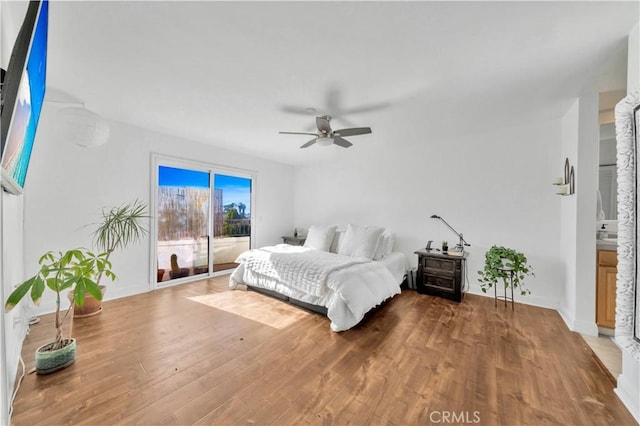 bedroom with hardwood / wood-style flooring and ceiling fan