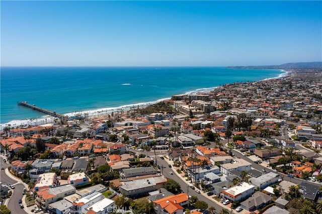 drone / aerial view featuring a view of the beach and a water view