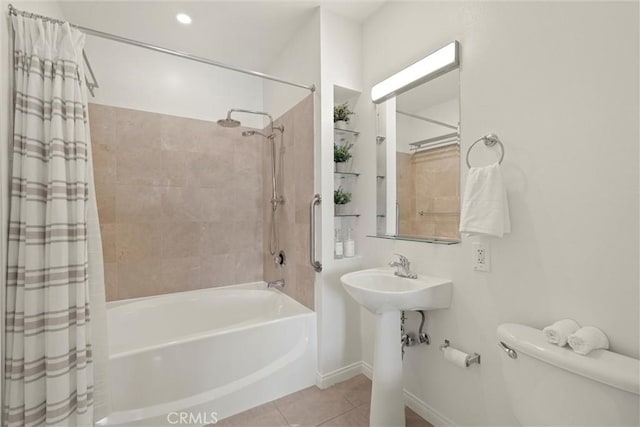 bathroom featuring shower / bath combo, tile patterned floors, and toilet