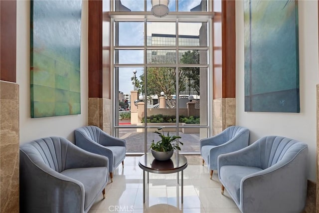 sitting room featuring light tile patterned flooring