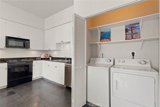 clothes washing area with washer and clothes dryer and sink