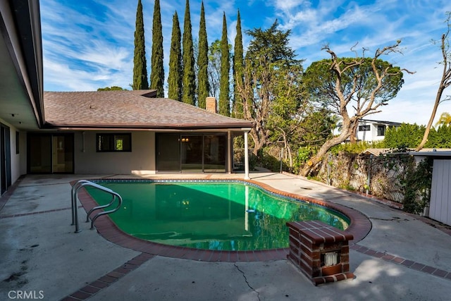 view of swimming pool featuring a patio area