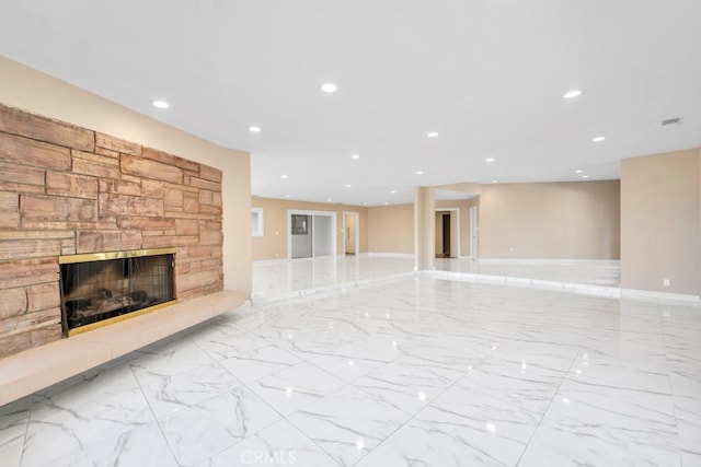 unfurnished living room with a fireplace