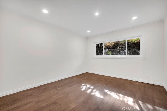 empty room with dark wood-type flooring