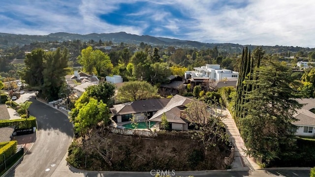 birds eye view of property featuring a mountain view