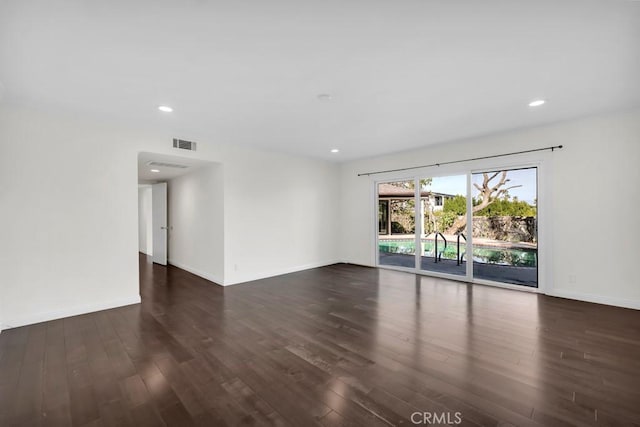 unfurnished room featuring dark hardwood / wood-style floors