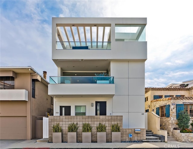 contemporary home with an attached garage and stucco siding