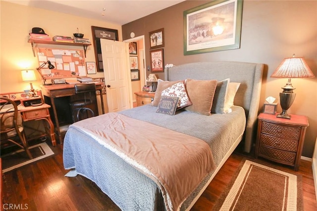 bedroom featuring dark wood-type flooring