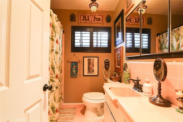 bathroom with vanity and toilet