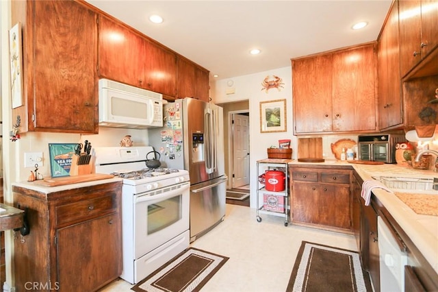 kitchen with white appliances and sink